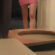 A hidden camera has supposedly been set up in a bathroom and records a woman having bowel movement while sitting on a toilet. Lots of great plopping sounds, and a few nice farts, but no visible pooping. Great for audio lovers!